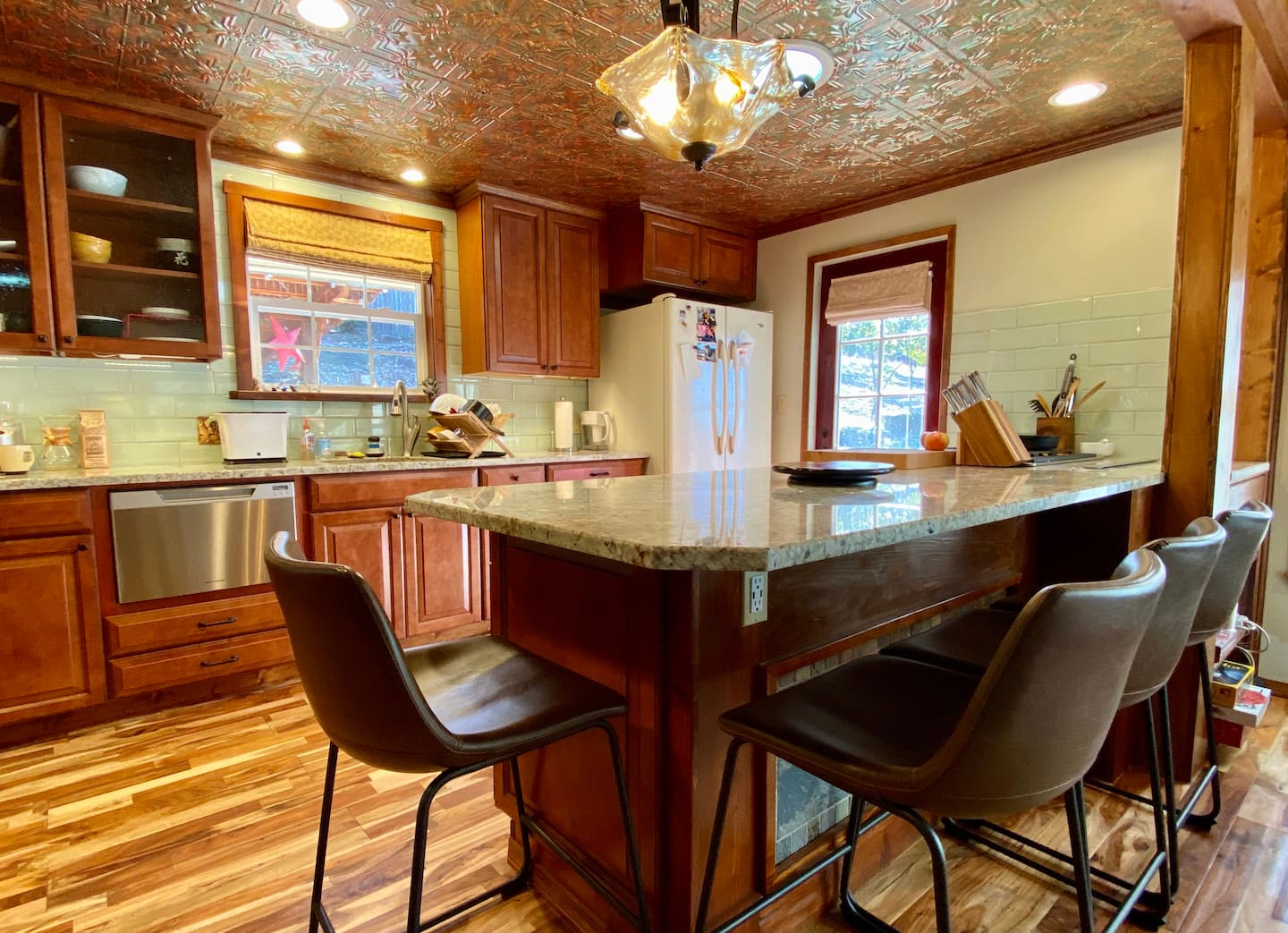 There's no official dining room at the cabin but this bar comfortably seats 4 at counter height stools