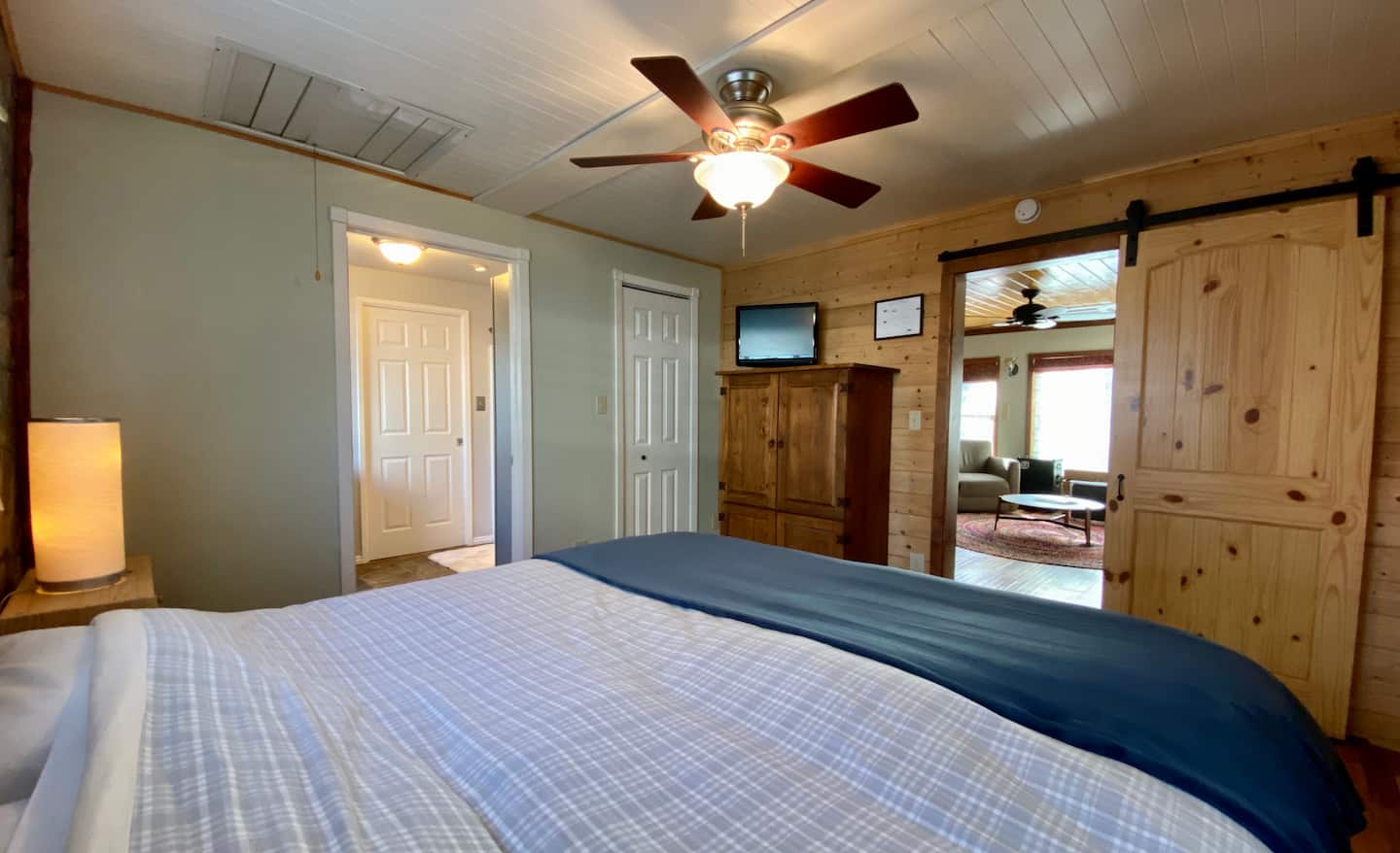 From the corner of the bedroom you can see into the bathroom and the living room