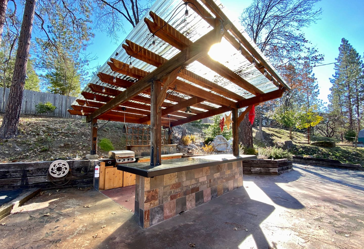 Come out the back door of the cabin to the outdoor kitchen—perfect for grilling and cooking outside